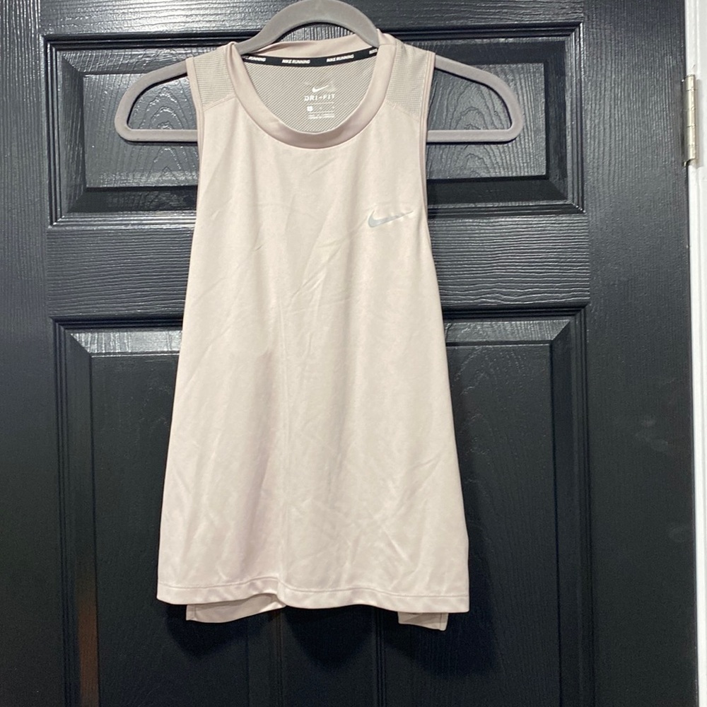 Woman’s tan color Nike running tank top. Size large.